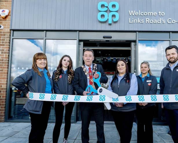 Mayor of Blyth Warren Taylor cut the ribbon on the new store alongside manager Kayleigh Davidson and some of the store team. (Photo: John Millard/UNP)