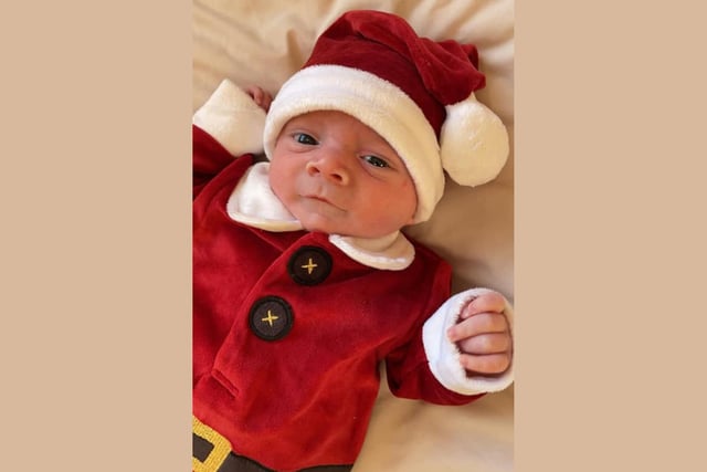 Axel Brown-Waddell, age 4 weeks, ready to celebrate Christmas.