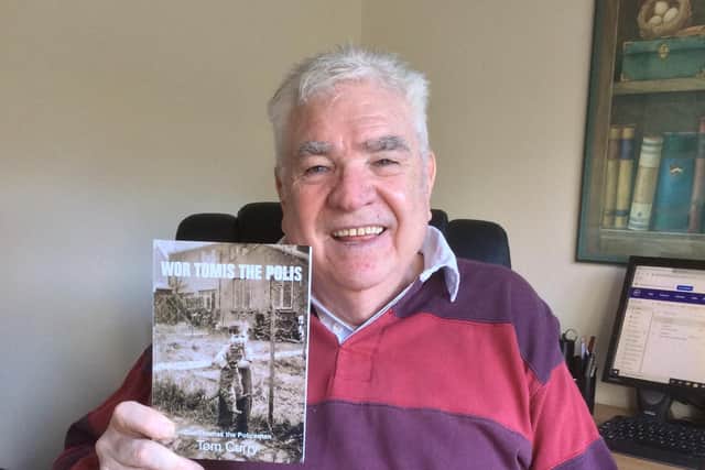 Tom Curry with his book, Wor Tomis the Polis.