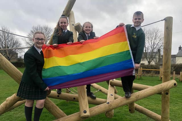 Warkworth C of E Primary School pupils with the Rainbow Flag.