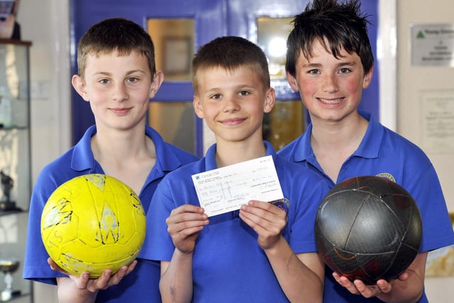 Lindisfarne Middle School pupils raised £53 for the Red Cross to use in Japan by holding a football match with Euan Moir (centre) and the team captain Sam Eggleston and Samual Eastham, in April 2011.