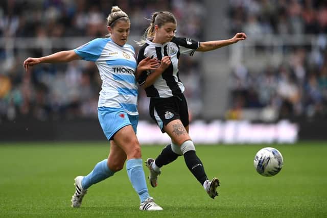 Newcastle player Kacie Elson is challenged by Alnwick Town defender Kirsty Armstrong during the FA Women's National League Division One North match against Alnwick Town Ladies at St James' Park. Picture: Getty Images