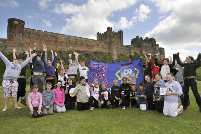 Pupils from Seahouses Middle School celebrate the completion of their walk to Bamburgh for the Jam Jar Army appeal in 2011.