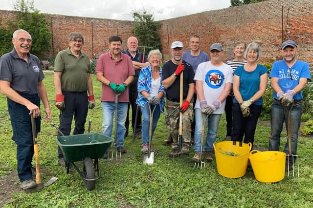 Some of the volunteers clearing the walled garden in readiness for its restoration.