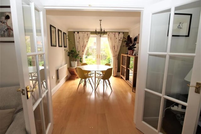 This attractive room includes ceiling and easterly facing 'French' exterior doors leading to the rear garden.