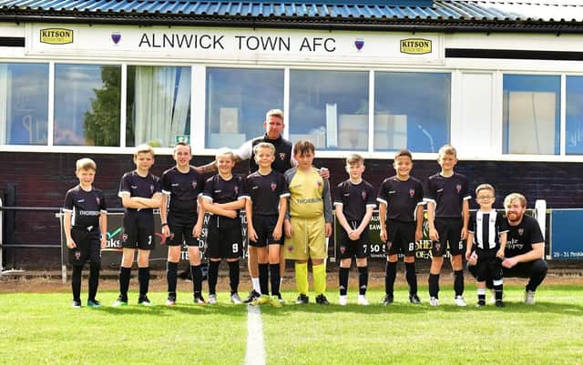 Alnwick Town U11 ‘Whites,’ who have won their league, pictured with manager Stephen Hogg outside the St James’ Park clubhouse.