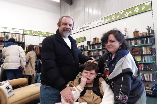 The store was officially opened by Amy Wilson Herron (centre), who receives support from the hospice, dad Andrew Wilson (left), and sister Jasmine Wilson Herron. (Photo by Craig Buchan)