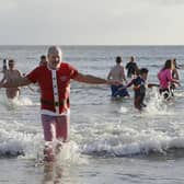 The New Year's Day dip at Alnmouth is a tradition for many who brave the cold water in fancy dress.