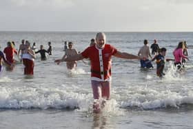 The New Year's Day dip at Alnmouth is a tradition for many who brave the cold water in fancy dress.