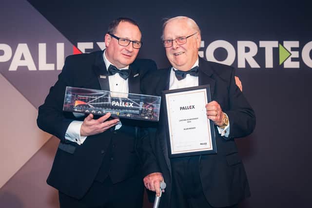 Kevin Buchanan, group CEO of Pall-Ex, presents Alan Moody with his lifetime achievement award.