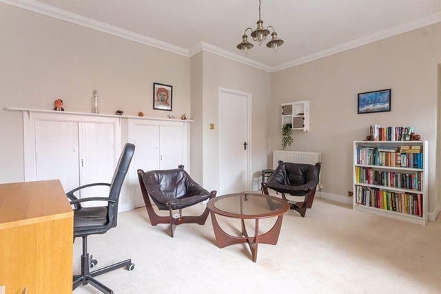 Additional generous reception space, currently used as a home office, which has a door to the courtyard.