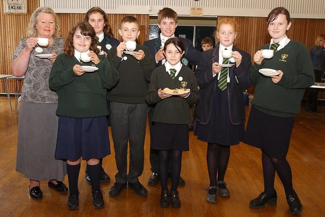 Pupils from St Oswald's School In Alnwick helping out during the World's Biggest Coffee Morning for Macmillan Cancer Relief in September 2004.