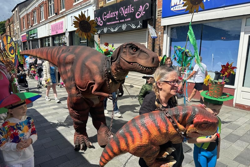 A dinosaur in the parade.