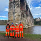 Anne-Marie Trevelyan and the Network Rail team at the bridge.