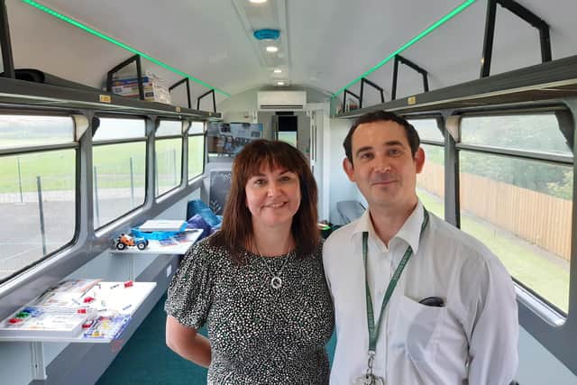Deputy headteacher Sally Collins and outdoor learning teacher James Groundwater, who leads the train project, in the finished STEM classroom