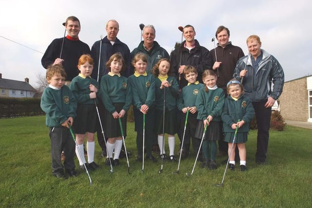 Warkworth First School dads lead the way playing golf in March 2003.