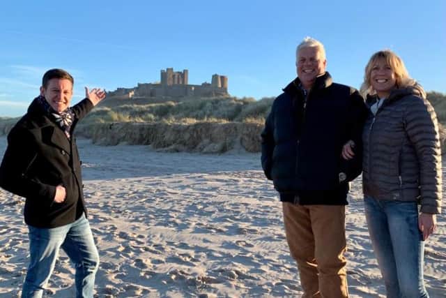 Matt Baker at Bamburgh with castle owners Francis and Claire Watson-Armstrong.