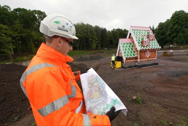 Trainee site manager for Robertson NE, Cameron Calvert looking at plans for Lilidorei.