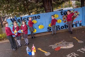 St Robert's Catholic First School pupils add the finishing touches to their new mural. Picture by Kate Buckingham.