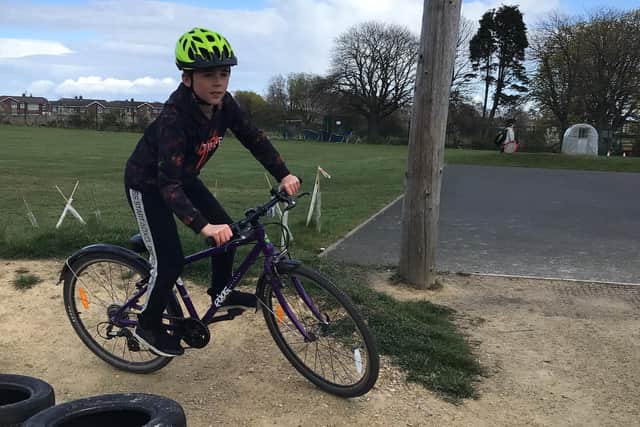 A pupil enjoying the bike track at Mowbray Primary School.