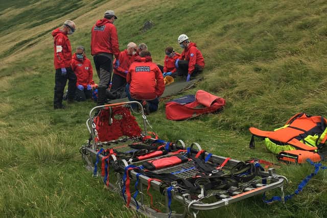 Members of Northumberland National Park and North of Tyne Mountain Rescue Teams had to carry equipment with them to help the mountain biker.