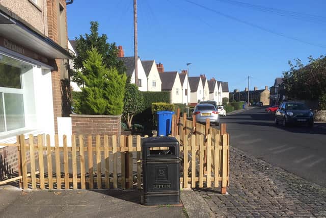 A new fence erected on Victoria Terrace, pictured before a safety barrier was installed.