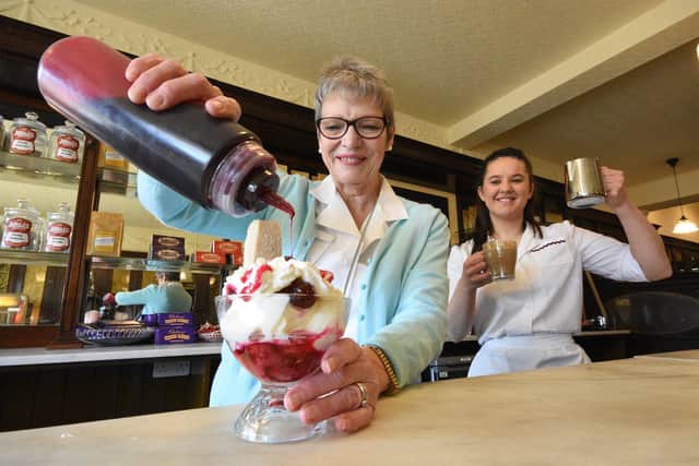 Susan Sams and Elizabeth Walls prepare sundaes and coffee to welcome customers to the 1950's "John's Cafe" Beamish.