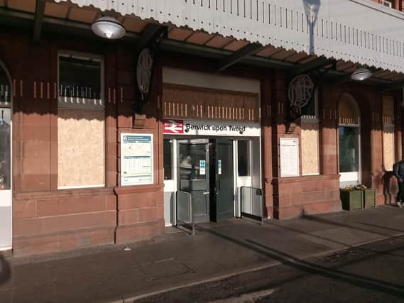 The windows at the front of the station have been boarded up after the raid, with the station now reopen to passengers.