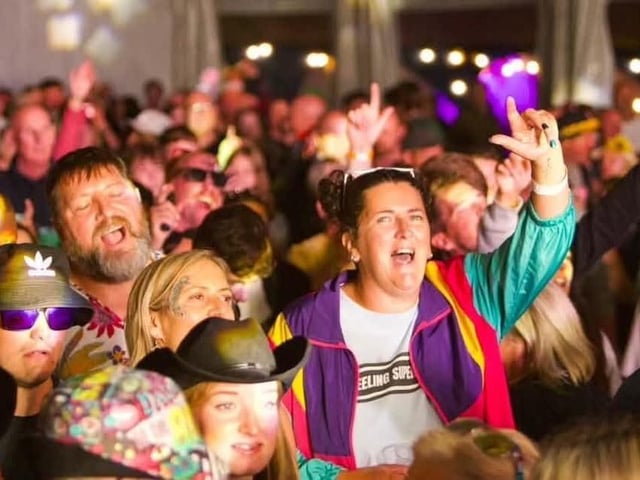 Some of the crowd in party mood