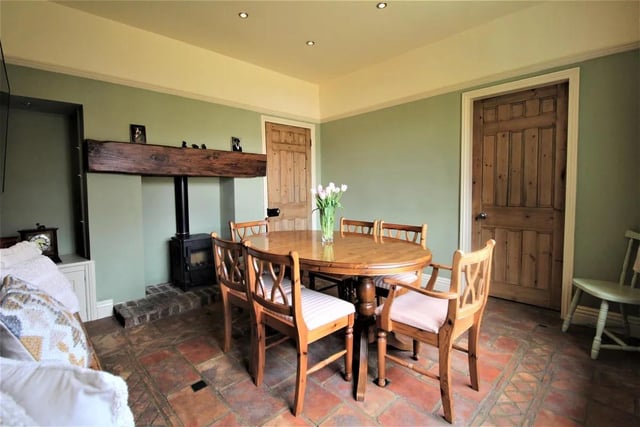 The property includes a dining room featuring a small fireplace.