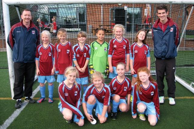 Lowick United U11's girls are pictured in 2013 in their new kit kindly provided by Graham Guthrie with their coaches Andy Thorpe and Adam Rutherford. 
Picture by Lani Rae.