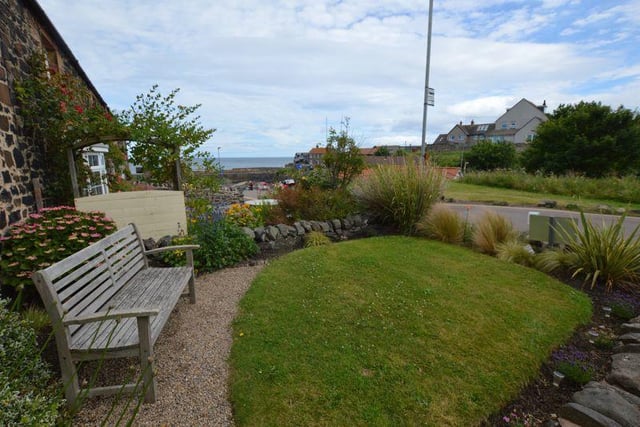 The front garden offers commanding views of the harbour and out to sea.