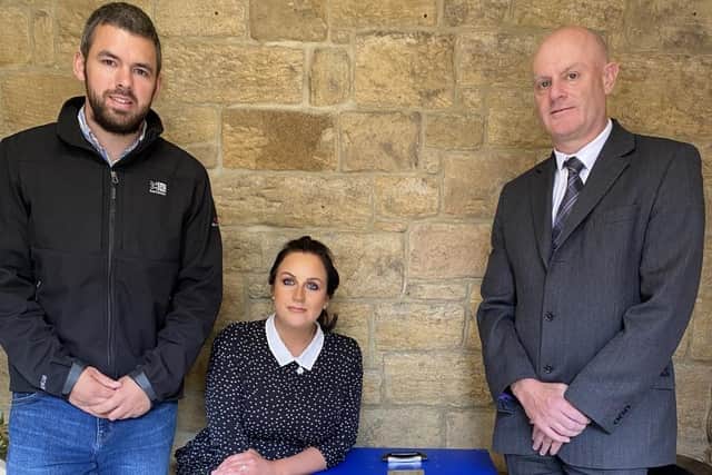Natalie and Callum Laidlaw present a cuddle cot to Peter Townsend of William Purves funeral directors in Alnwick.