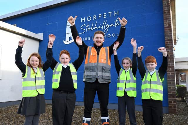Richard Shingleton with a group of pupils from Stobhillgate First School.