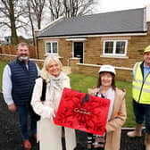Scott and Diane Cowan complete their purchase at Southfields Acklington and as the first buyers over the line, are presented with chocolates by Lynn Grant, sales negotiator for
WalkersXchange. Also pictured is Paul Graham of Surgo Construction.