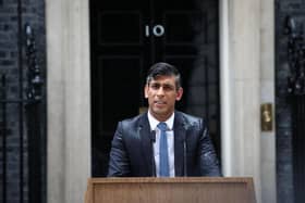 Rishi Sunak announced the date for the general election in the rain outside 10 Downing Street. (Photo by HENRY NICHOLLS/AFP via Getty Images)