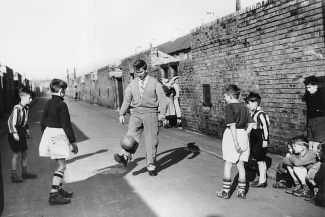 Sir Bobby Charlton gets back into gentle training on Beatrice Street, Ashington, in February 1958 while recuperating from injuries sustained in the Munich air disaster. (Photo by Keystone/Getty Images)