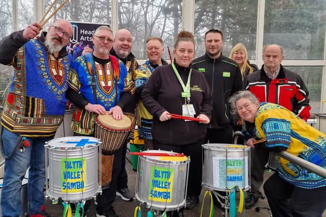 Blyth Valley Samba members Ivan Allan, Kevin Worley,  Brian Johnson, Paul Storey, Helen Mackay, Paul Mackay, and Tracy Fairrie-Turnbull with ASDA community champion Diane and her colleague Andy during the drumming morning. (Photo by Blyth Valley Samba)