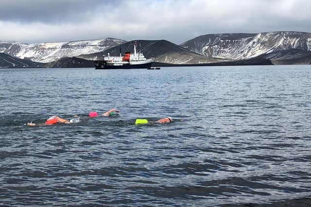 Jane Hardy with fellow extreme swimmers in Telephone Bay, Antarctica.