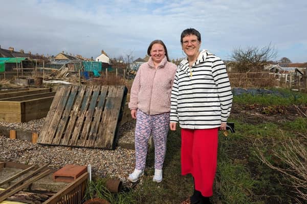 Melanie Deans of Border Links (in red trousers) with one of the service users.
