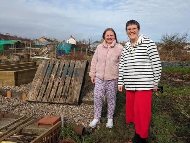 Melanie Deans of Border Links (in red trousers) with one of the service users.