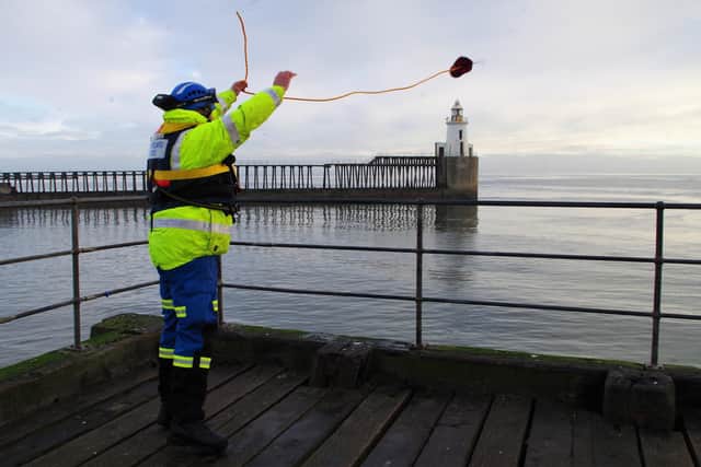 Station Officer Dave Lucas from Blyth casting a line from Blyth's West Pier.