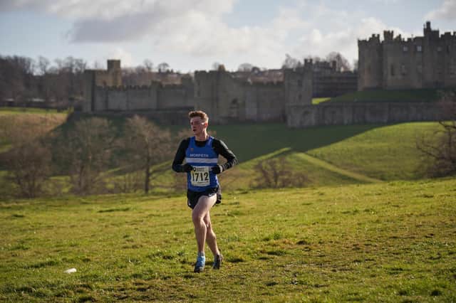 Phil Winkler on his way to victory in the Senior Men's race in front of Alnwick Castle on Saturday.