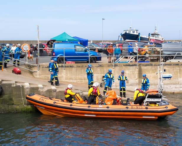 The rescued paddle boarder was helped back onto dry land in Seahouses by the RNLI and HM Coastguard. (Photo by RNLI/Hazel Bettison)
