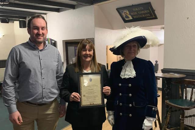 Wooler publican Nikki Lightfoot with Cllr Mark Mather and High Sheriff Joanna Riddell.