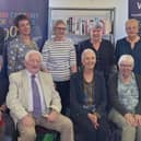 A group photograph at Lynemouth Library including Ann Cleeves, centre in front row.