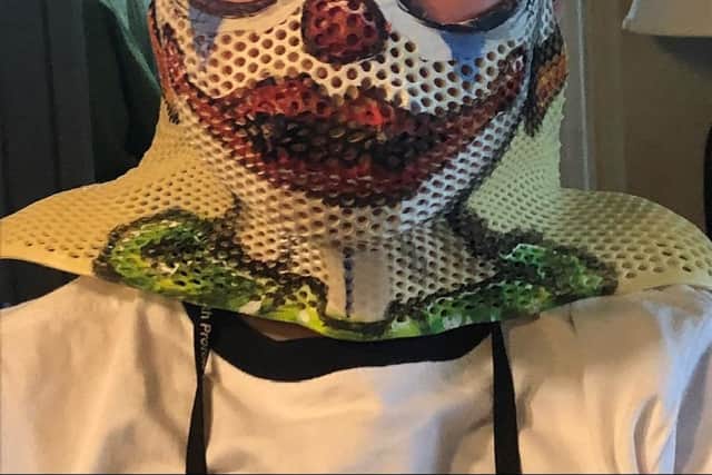 Ryan and the mask he had to wear during his proton beam therapy in Florida.
