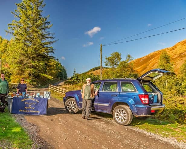 Sue and Rich Hurst meeting customers at Kidland Hill in a recreation of the historic photograph. (Susan Barwood Photography)