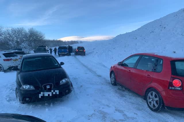 Cars struggle in the snowy conditions near Harthrope Valley
