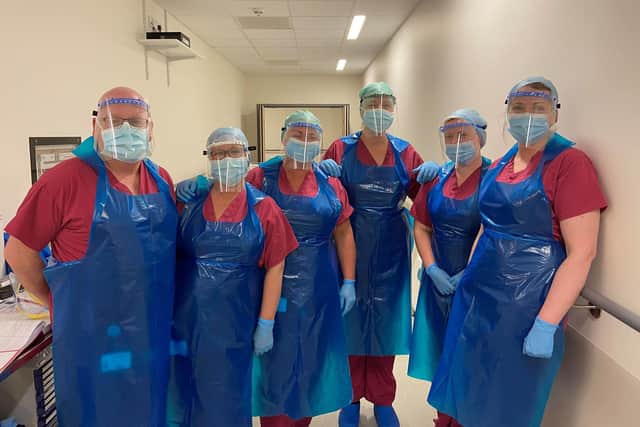 Staff who work in theatre at Northumbria Specialist Emergency Care Hostpital, Cramlington with visors supplied by Jake Towers & family.